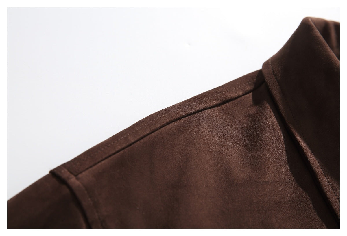 Close-up of the dark brown jacket's shoulder seam and collar edge.