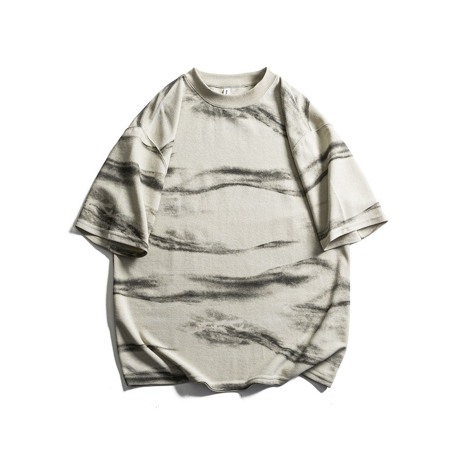 Beige short-sleeve crew neck T-shirt with gray horizontal brushstroke pattern, flat lay front view