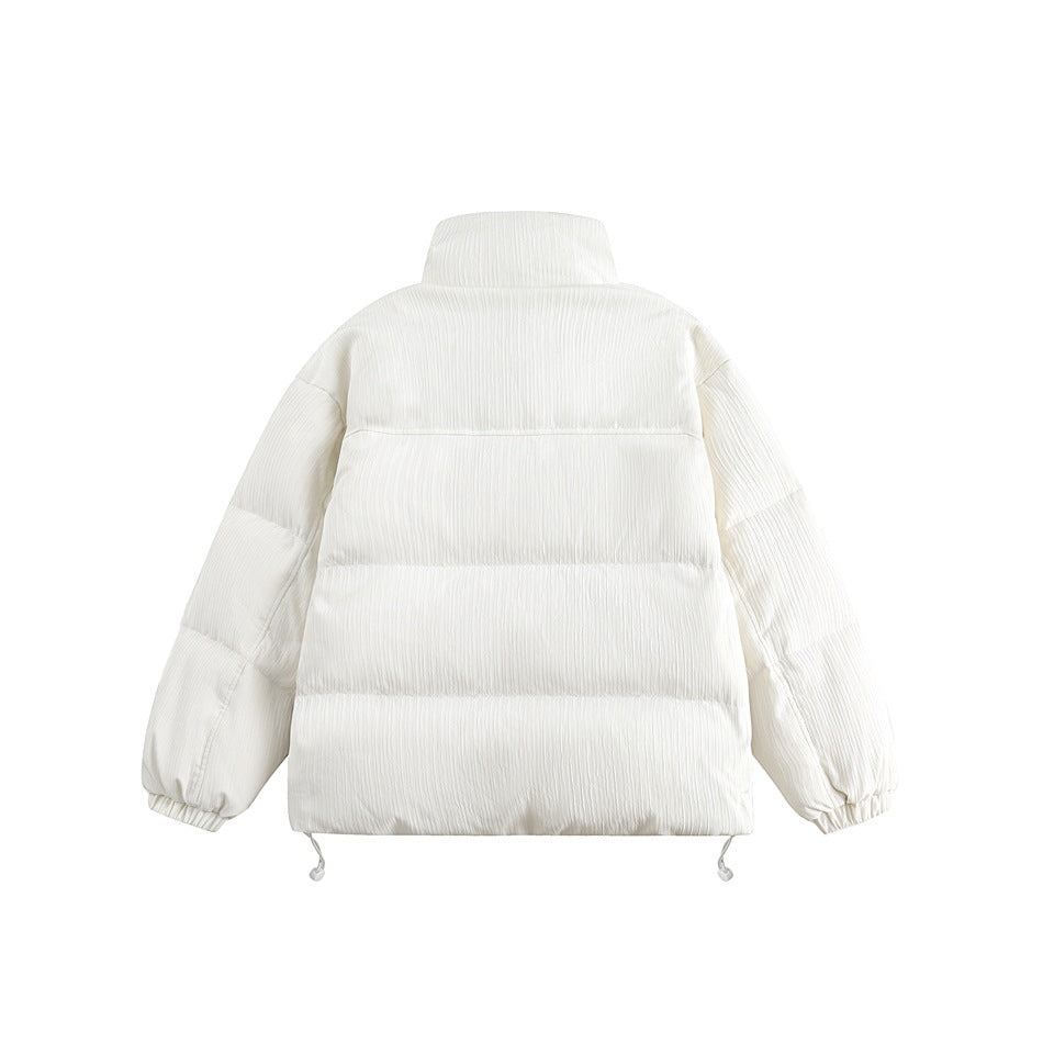 Back view of an ivory quilted puffer jacket shown flat against a white background, with elastic cuffs and hem drawcords.