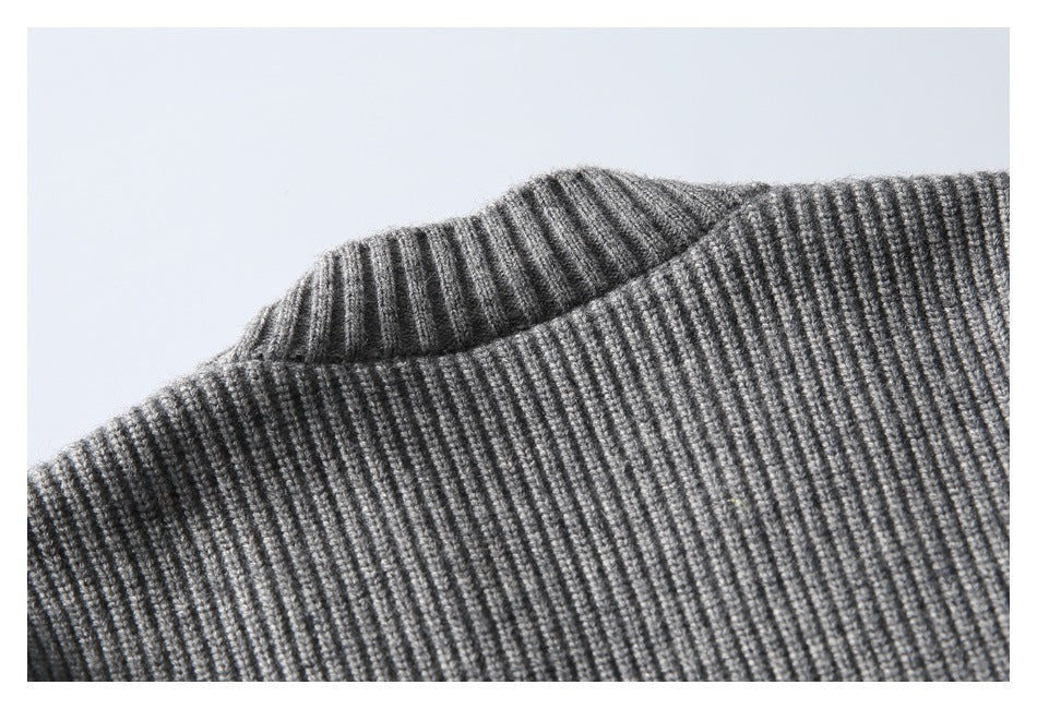 Close-up of a gray rib-knit sweater neckline and collar.