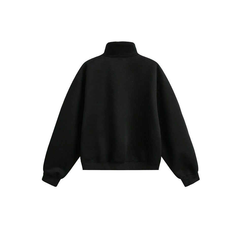 Back view of a black sweatshirt with a raised collar, dropped shoulders, long sleeves, and ribbed cuffs and hem.