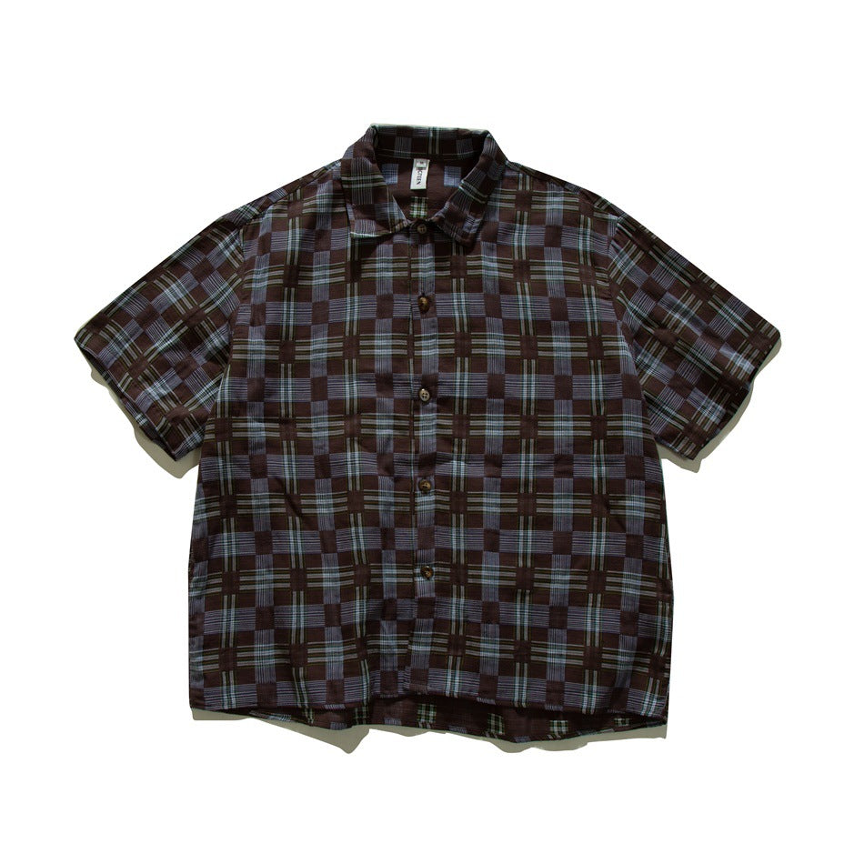 Brown, slate-blue and olive checkered plaid short-sleeve button-up shirt, front view flat lay
