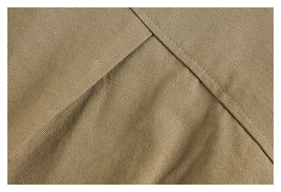 Close-up showing the khaki jacket fabric texture and seam construction.