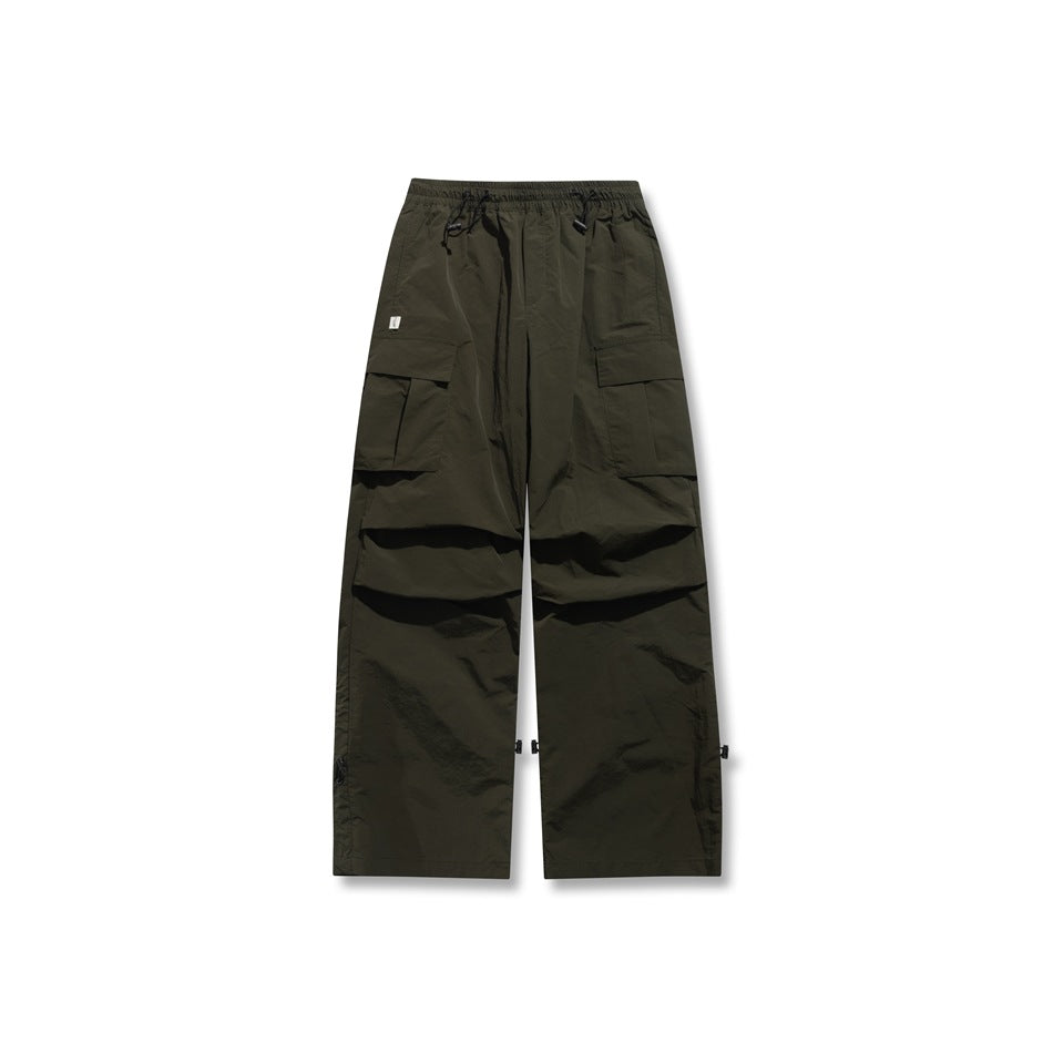 Dark olive green wide-leg cargo pants with drawcord waist, flap pockets and toggle hems, flat front view
