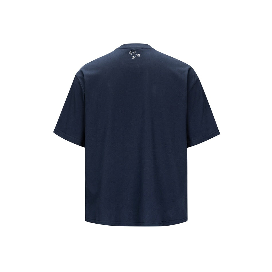 Back view of a navy short-sleeve crew-neck T-shirt with a small white embroidered motif below the collar.