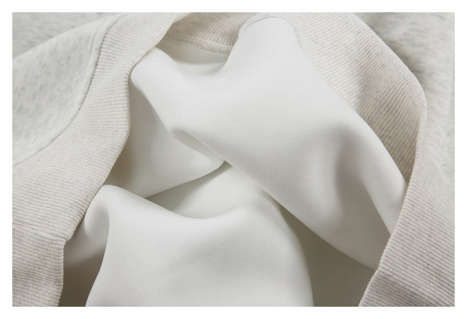 Close-up of the garment's smooth pale inner surface framed by a ribbed edge.