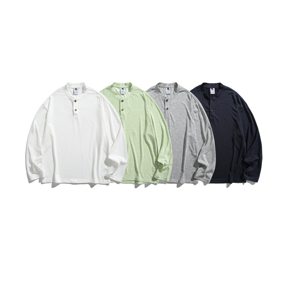 Four flat-lay long-sleeve shirts with band collars and button plackets in white, pale green, gray, and navy.