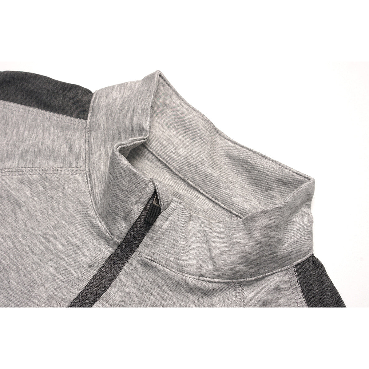 Close-up of a heather-gray quarter-zip top showing its stand collar and dark zipper trim.