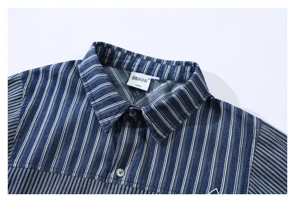 Upper front of a blue-and-white striped button-up shirt, showing the collar, buttons, and inner label.