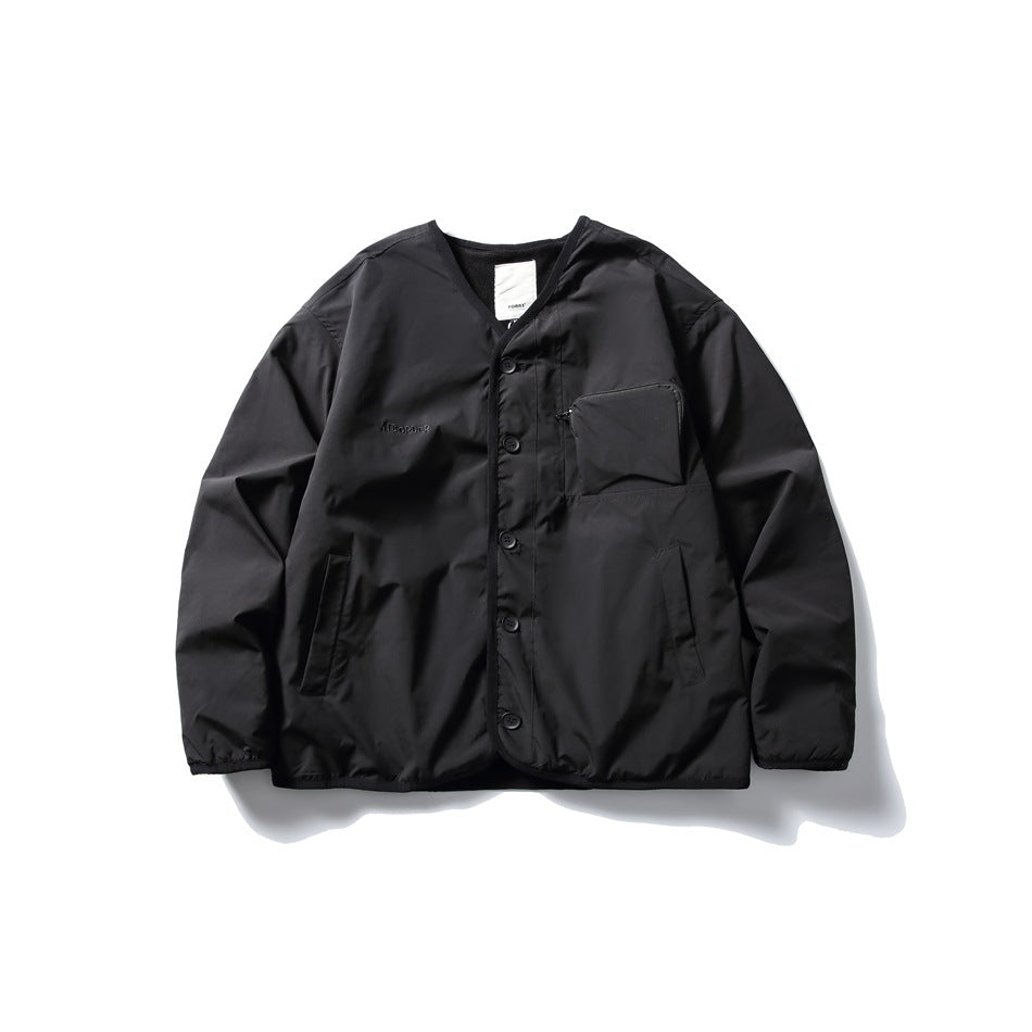 Black collarless button-front jacket flat lay with zip chest pocket, side pockets and fleece-like inner neckline