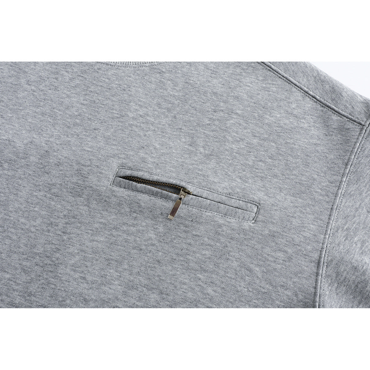 Close-up of a heather gray sweatshirt's horizontal zip chest pocket and textured fabric.