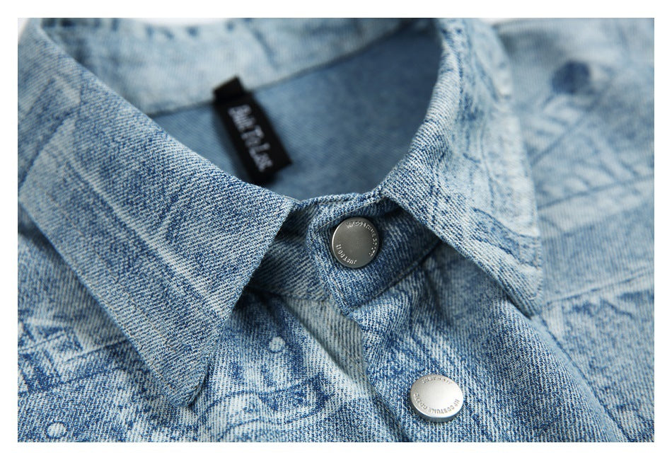Close-up of the pointed collar and two metal snap buttons on the light blue printed shirt.