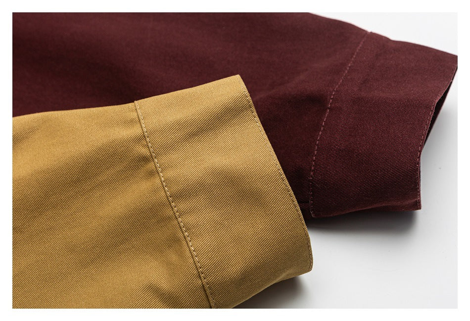 Close-up of jacket cuffs in mustard tan and deep burgundy, showing the fabric and stitching.