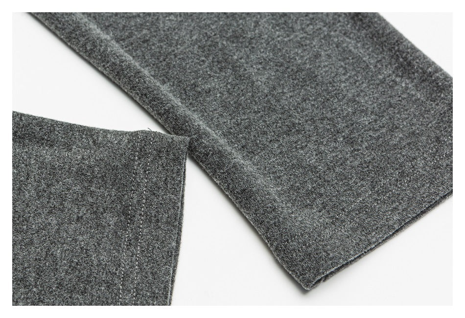 Close-up of a dark gray heathered sleeve with a stitched edge.