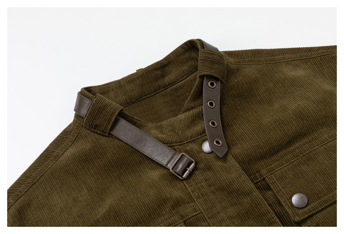 Close-up of the jacket collar with its brown strap unfastened, showing eyelets, buckle and a metal snap.