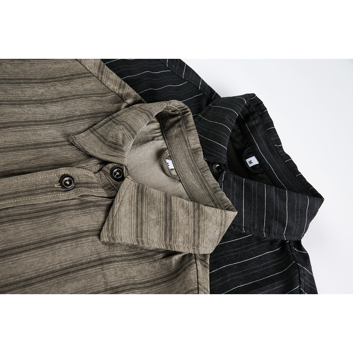 Close-up of overlapping taupe and black striped button-up shirts, showing their collars and buttons.