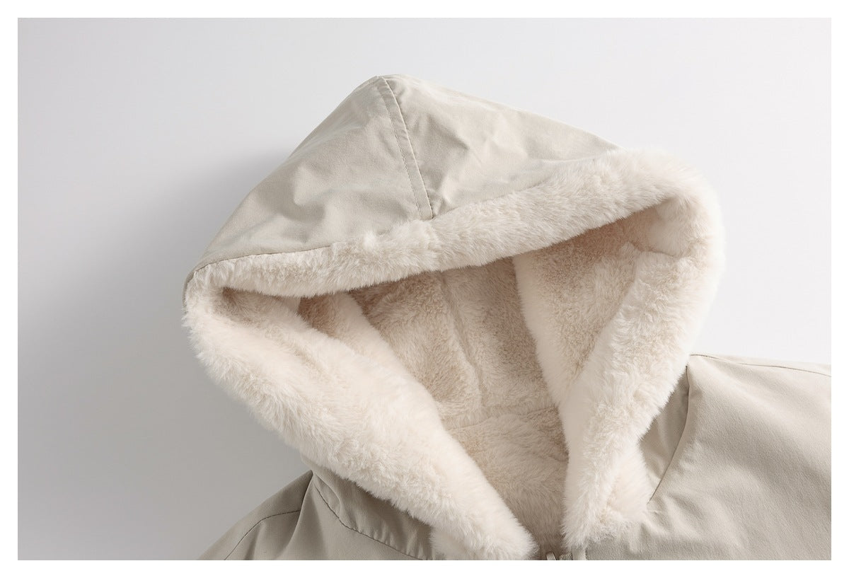 Close-up of a light jacket hood showing its plush lining and contrasting smooth outer fabric.