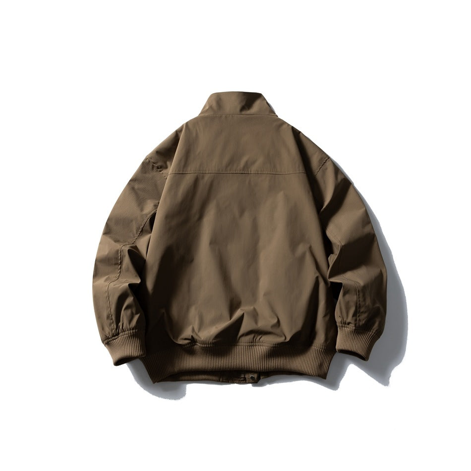 Back view of a brown stand-collar jacket with long sleeves and matching ribbed cuffs and hem.