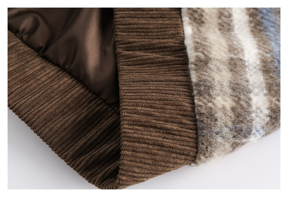 Close-up of a brown ribbed garment edge and smooth brown lining beside plaid fabric.