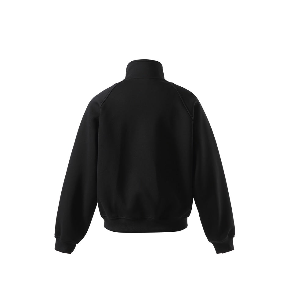 Back view of a black stand-collar jacket with raglan seams and ribbed cuffs and hem.