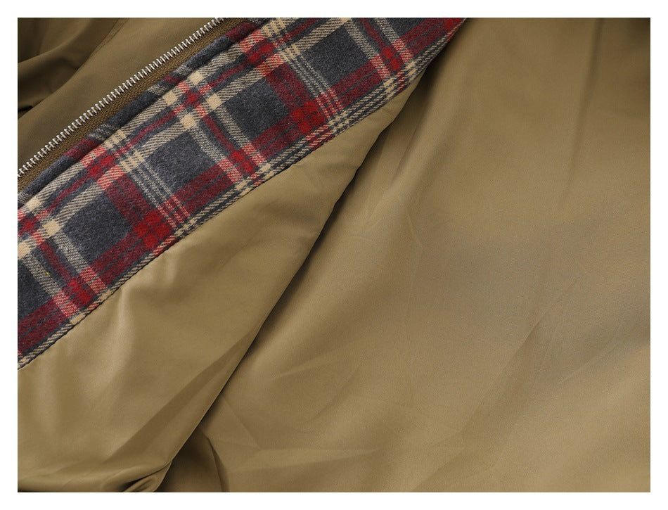 Close-up showing the khaki jacket's zipper and red, navy, and beige plaid lining.