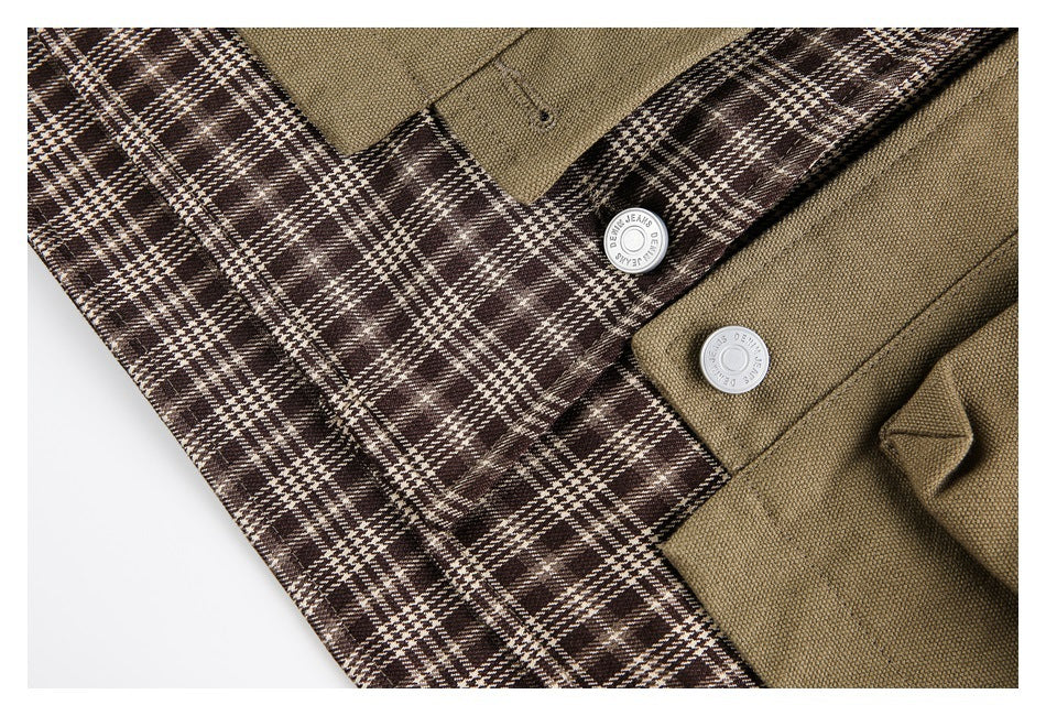 Close-up of brown plaid lining beside khaki jacket fabric and silver buttons.