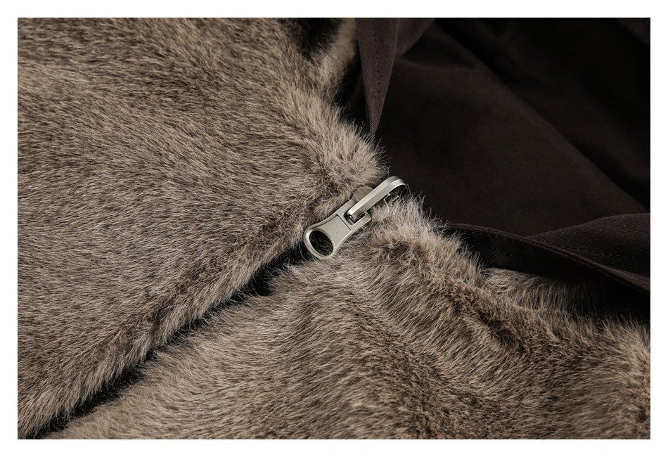 Close-up of a silver zipper set between brown-gray fur and dark lining.