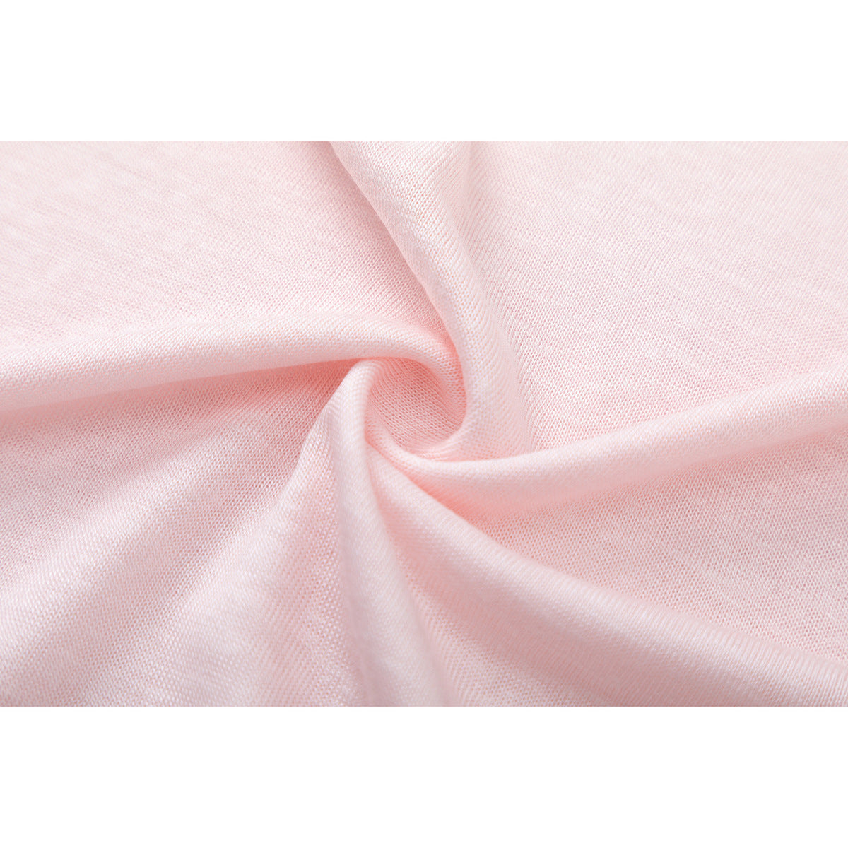 Close-up of pale pink fabric gathered into folds, showing its fine knit texture.