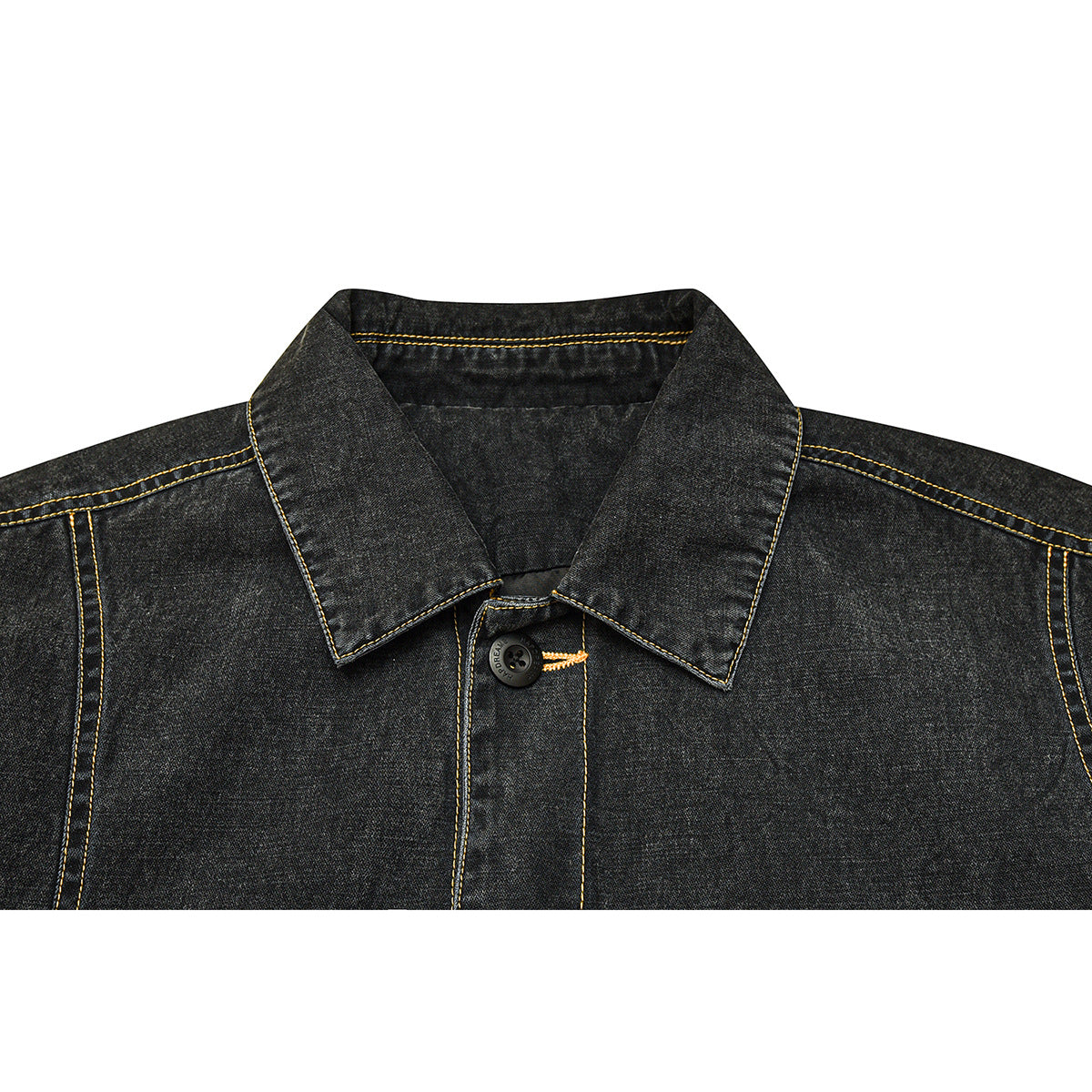Close-up of a charcoal denim jacket collar, black button and contrasting yellow stitching.