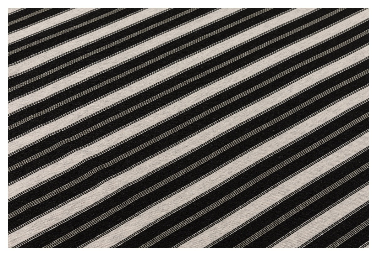Close-up showing the black and cream striped fabric pattern and fine knit texture.