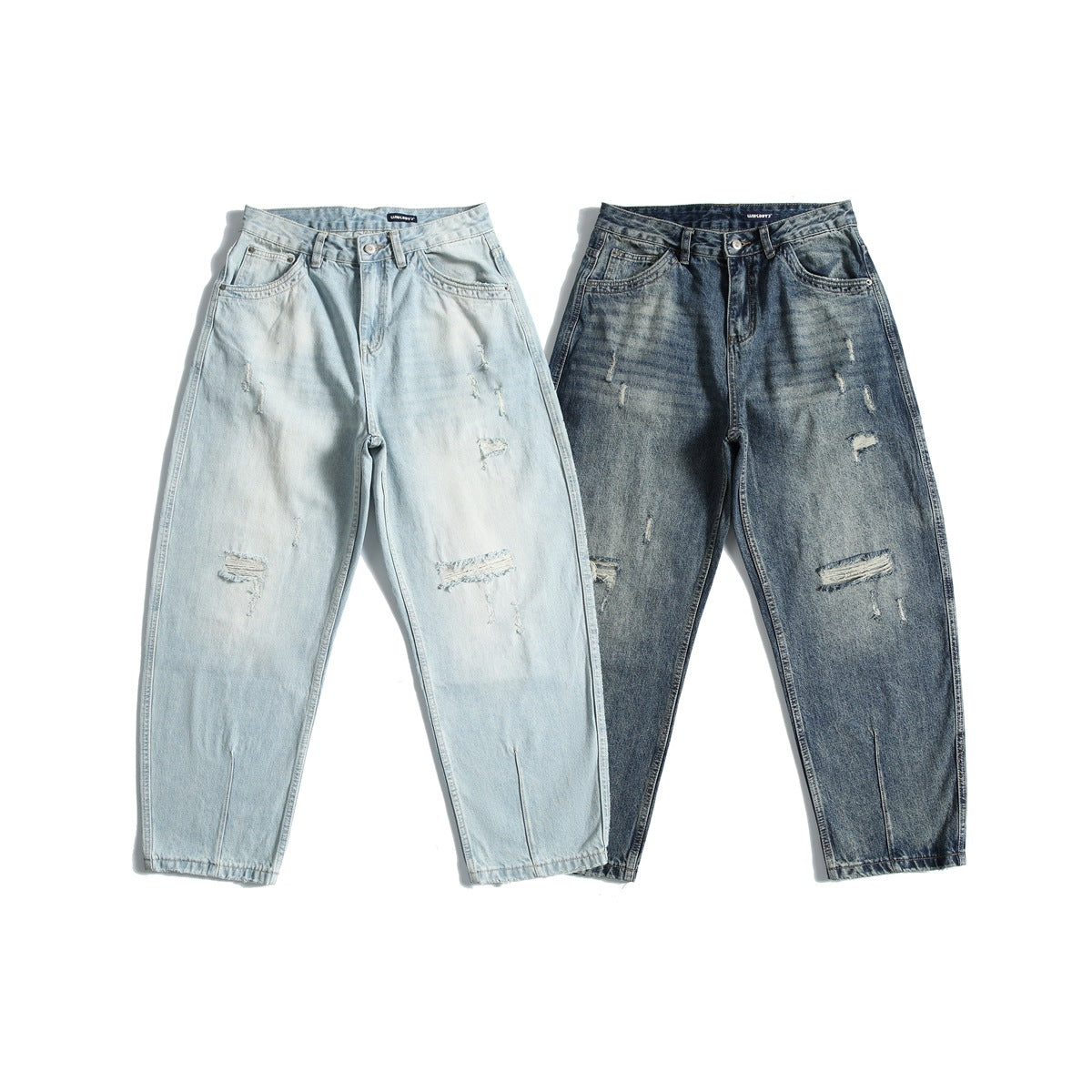 Two pairs of distressed jeans shown from the front: one pale blue and one dark blue, both with relaxed tapered legs.