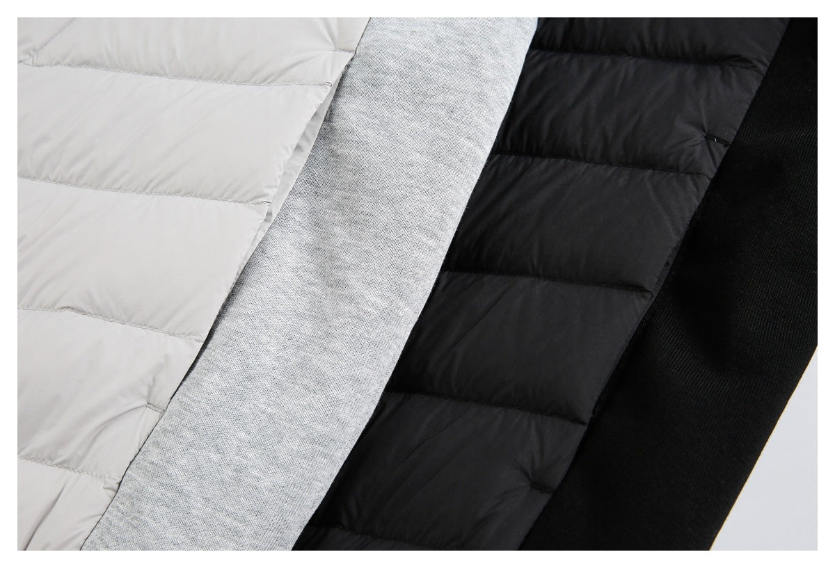 Close-up showing the jackets' light and black quilted panels beside gray and black sleeve fabric.