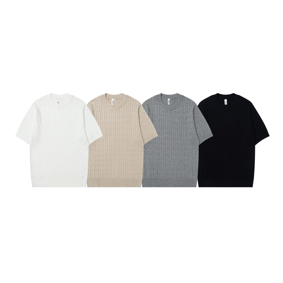 Four cable-knit short-sleeve tops in white, apricot, gray and black laid side by side
