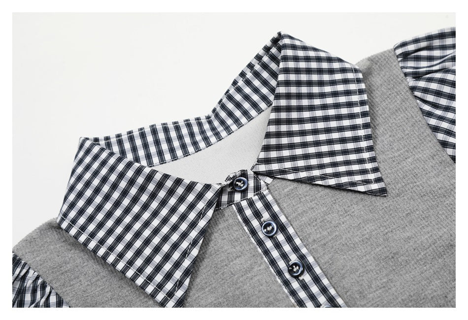 Close-up of the gray top's gingham collar, button placket, and front neckline.