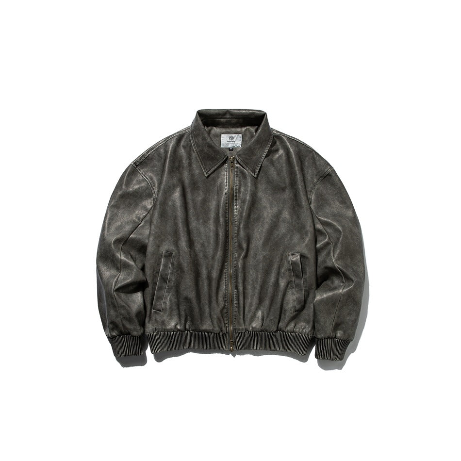 Front view of a charcoal-gray zip-front jacket with a pointed collar, two pockets, and ribbed cuffs and hem.