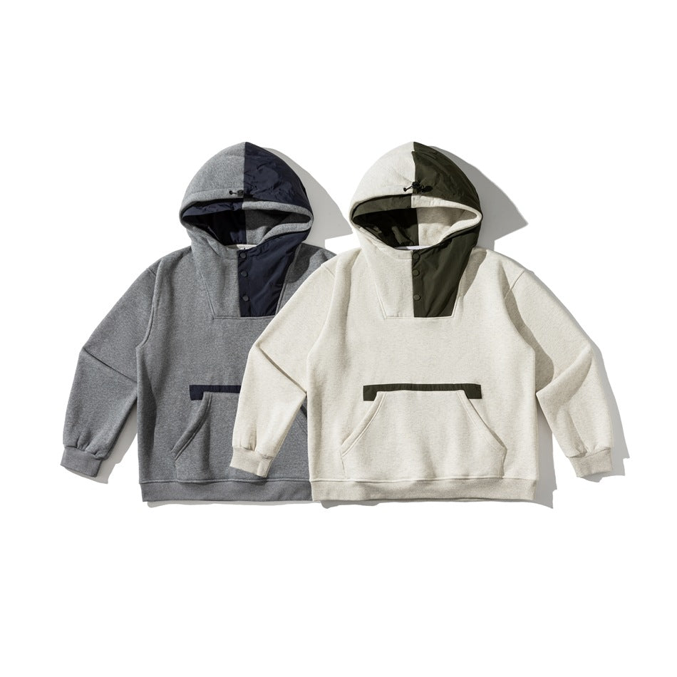 Two hoodies displayed together: one gray with navy details and one ivory with olive details.