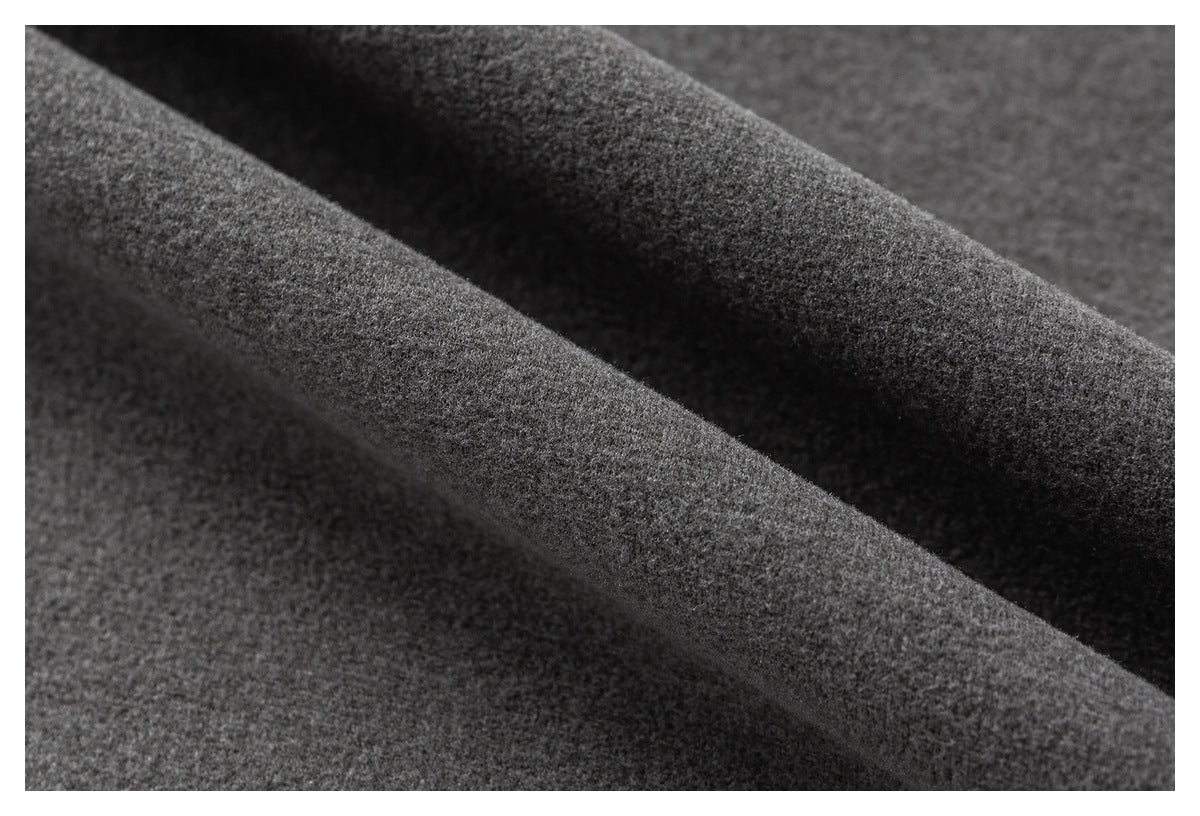 Close-up of gray fabric folded to show its soft-looking surface and thickness.