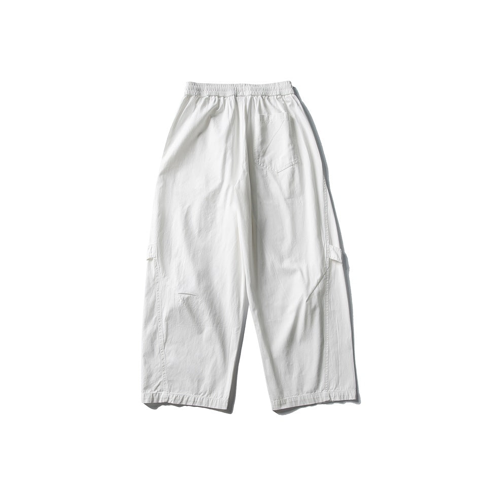 Back view of off-white wide-leg pants with elastic waistband and a patch pocket