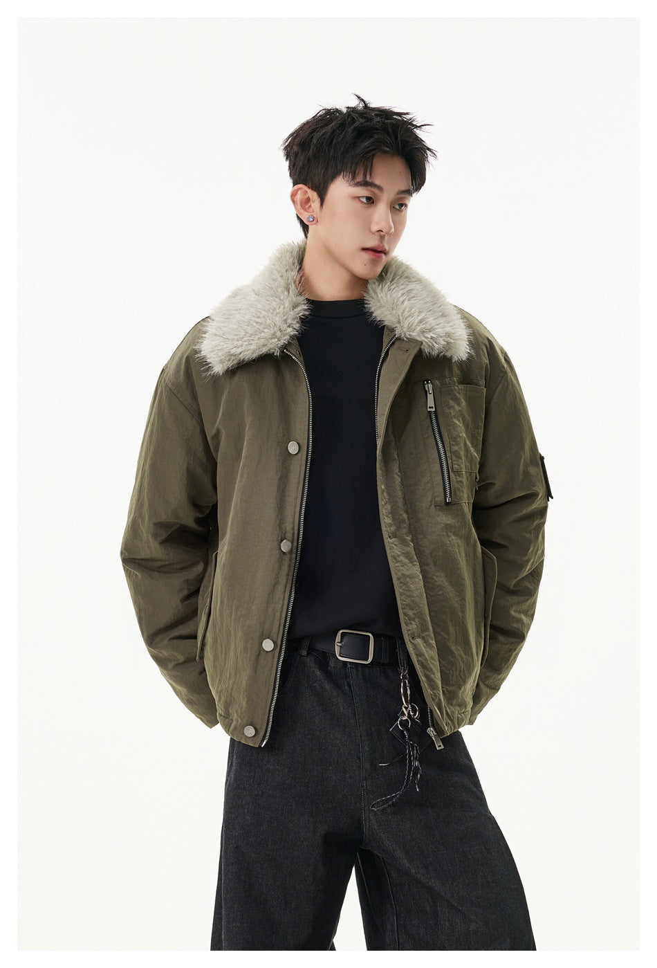 Model wearing an olive jacket with a pale shaggy collar, zip chest pocket and snap buttons.