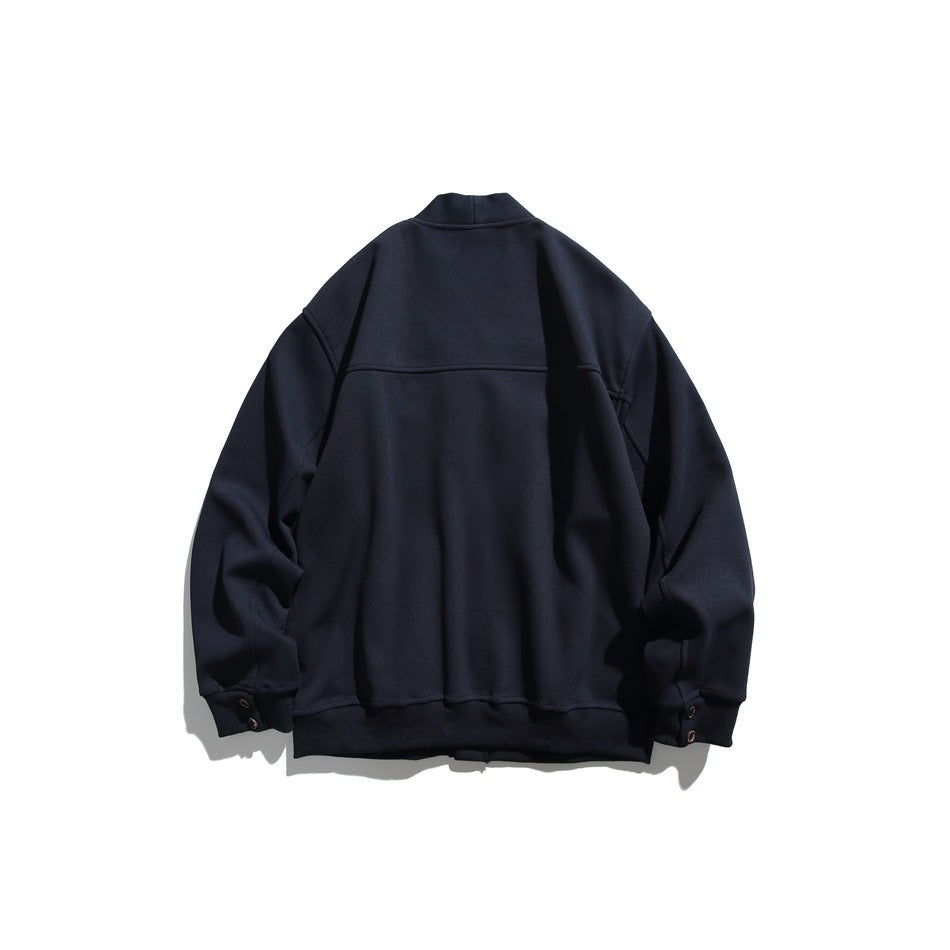 Navy cardigan jacket back view with yoke seam, ribbed hem and snap buttons at the cuffs, flat lay