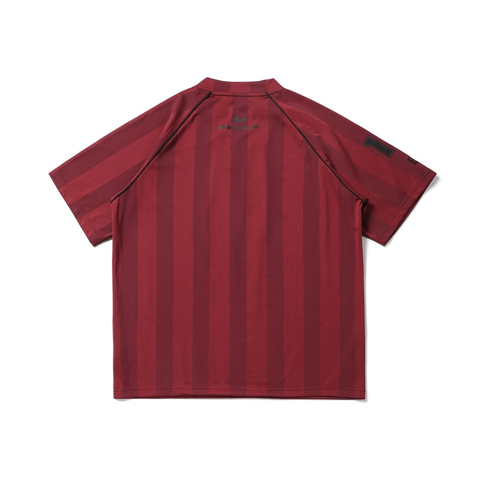Back of a burgundy short-sleeve jersey with tonal vertical stripes, black piping, and a small logo.