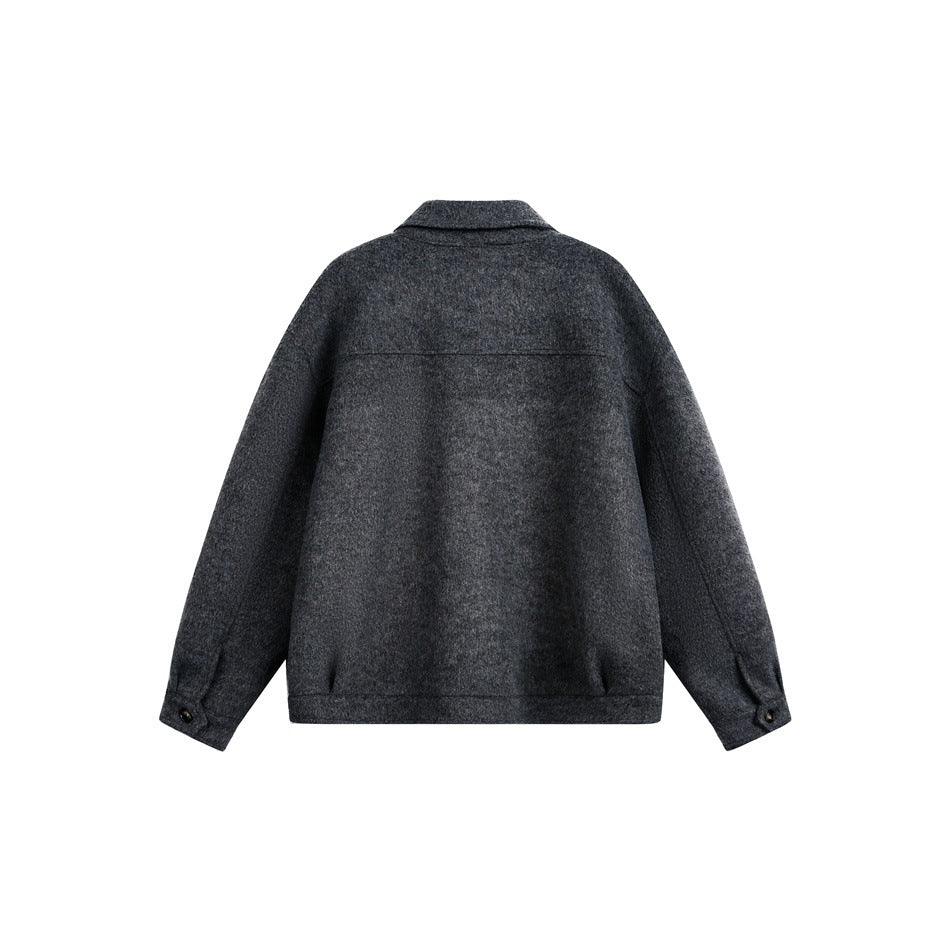 Back view of a charcoal collared jacket with long sleeves and buttoned cuffs, displayed flat.