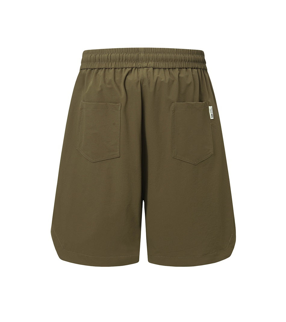 Olive-brown knee-length shorts shown from the back, with an elastic waistband and two patch pockets.
