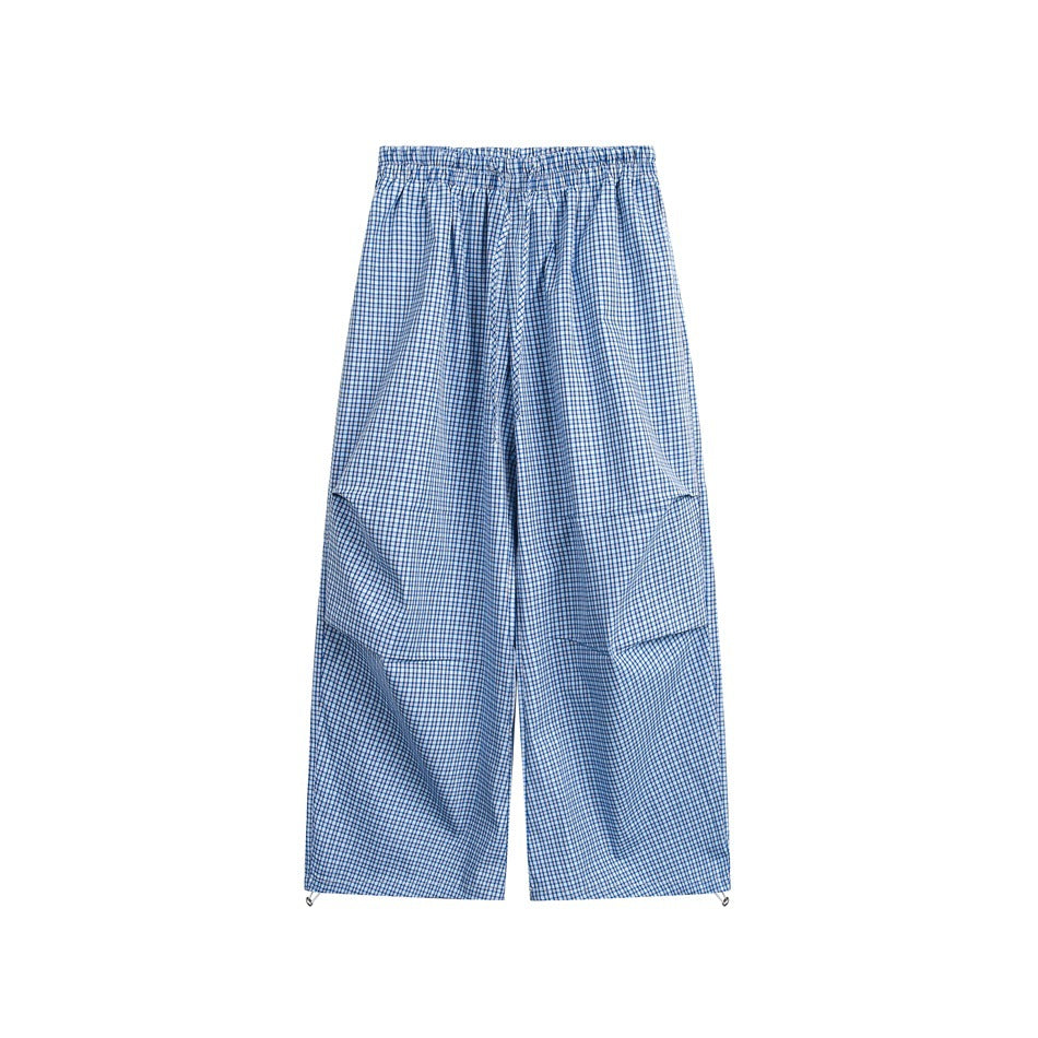 Blue small-check wide-leg pants with elastic drawstring waist and toggle hems, flat front view