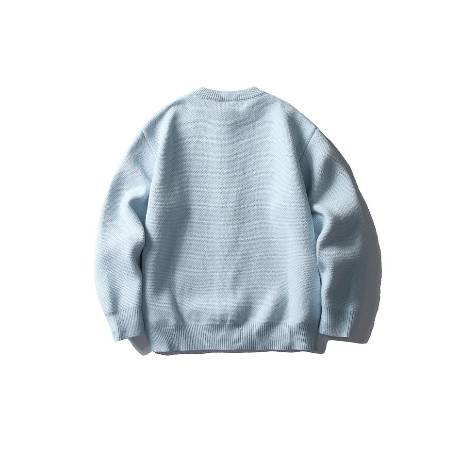 Back view of a pale blue long-sleeve knit cardigan with a round neck and ribbed cuffs and hem.
