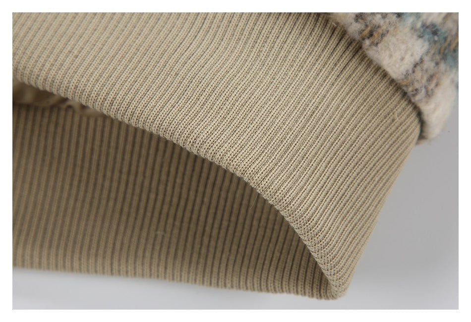 Close-up of the beige ribbed collar on the fuzzy checked jacket.
