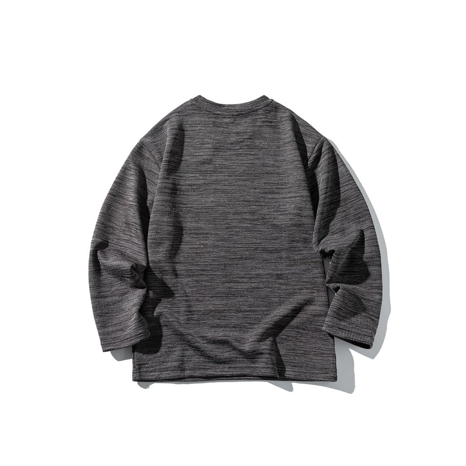 Back view of a charcoal and gray marled long-sleeve crewneck sweatshirt laid flat on white.
