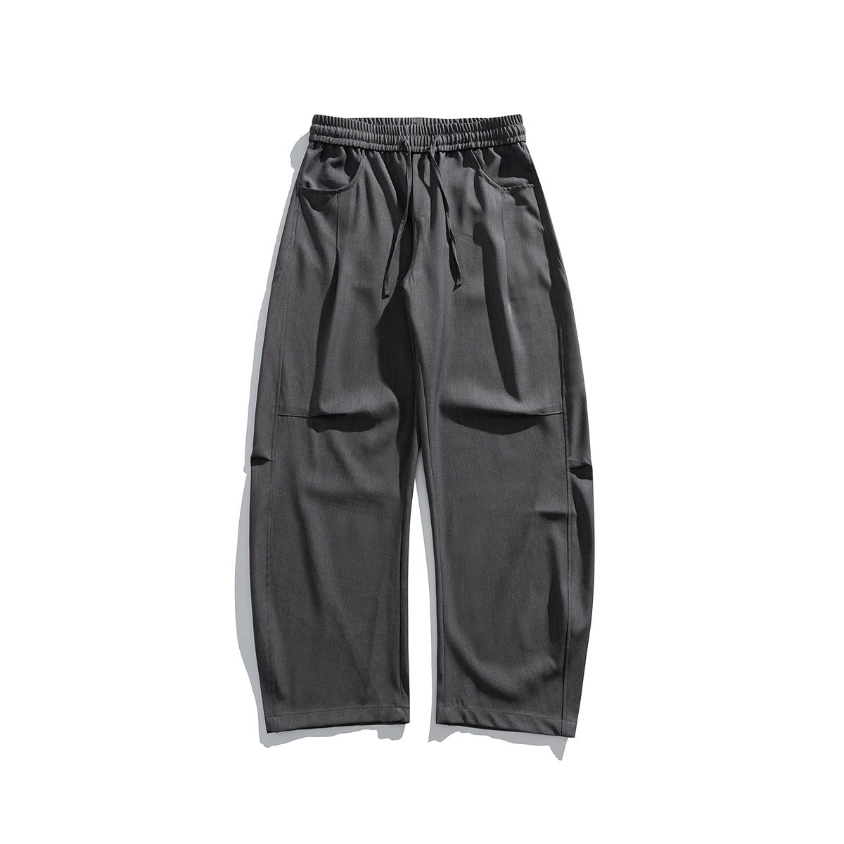 Dark gray wide-leg drawstring trousers with elastic waist and front pockets, flat lay front view