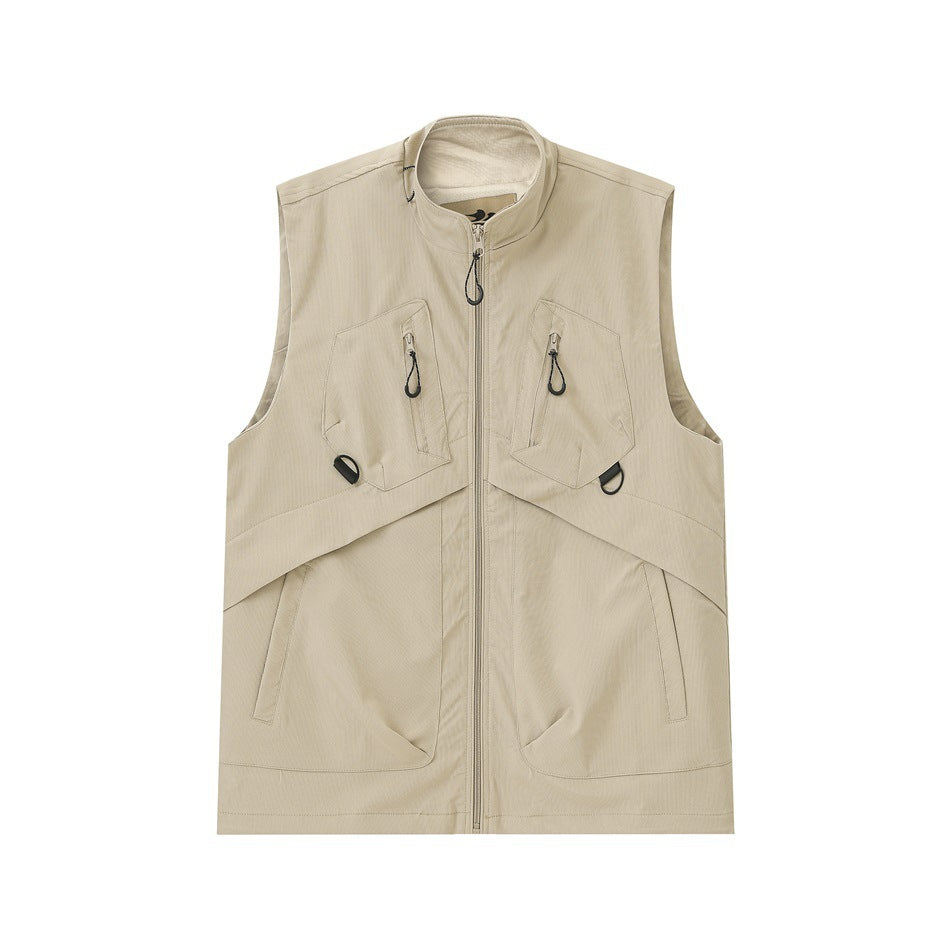 Light khaki zip-front utility vest with stand collar, chest zip pockets and large lower pockets, flat lay front view