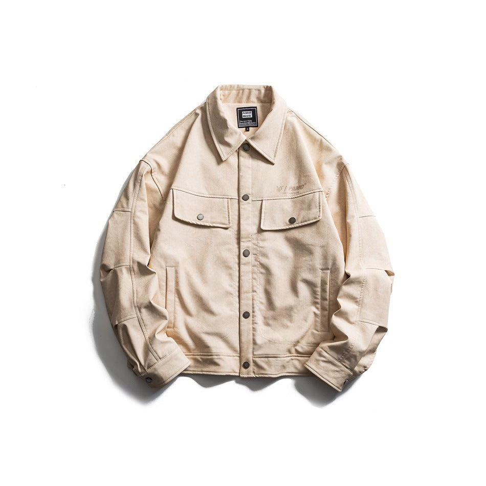 Apricot button-front jacket with pointed collar, chest flap pockets and snap cuffs, laid flat